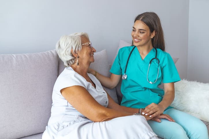A nurse consoling a patient at a nursing & rehabilitation center in GreenAcres Place in Bossier City, LA