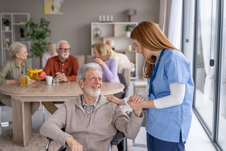 Guide to Choosing a Care Facility Nurse aids elderly man in wheelchair Bossier City LA